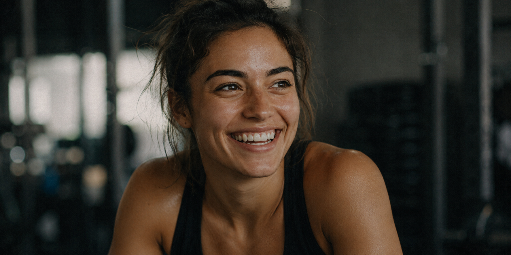 Woman smiling in a gym setting